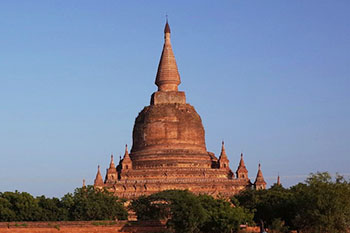 brown concrete building near green grass field during daytime Myanmar, Old Bagan | Photo by Kentaro Komada on Unsplash