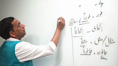 video thumbnail of faculty writing on a whiteboard